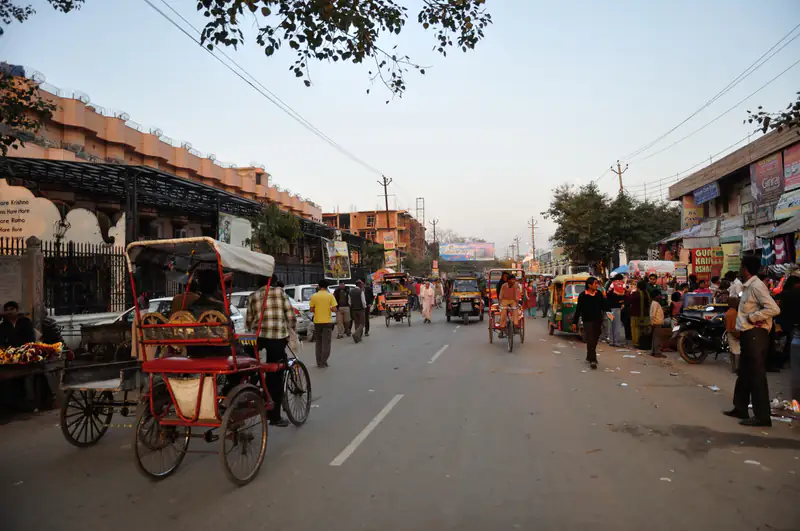 Street in Vrindavan with cycle rickshaws at dusk